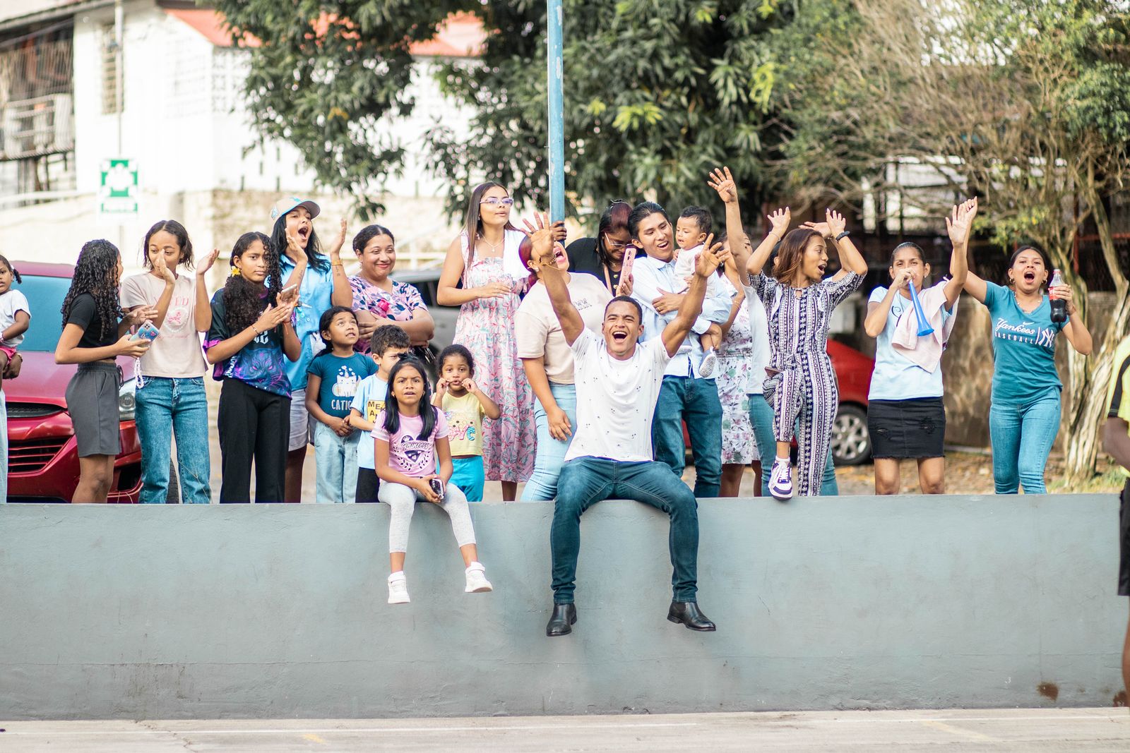 Families and neighbors celebrating at an outdoor community gathering