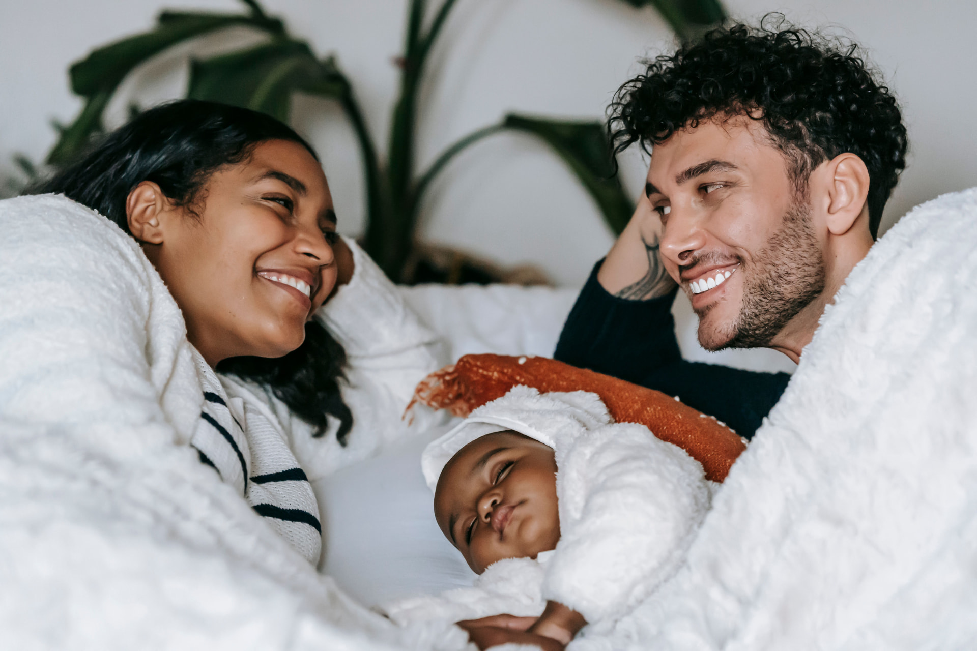 Parents resting peacefully with their baby