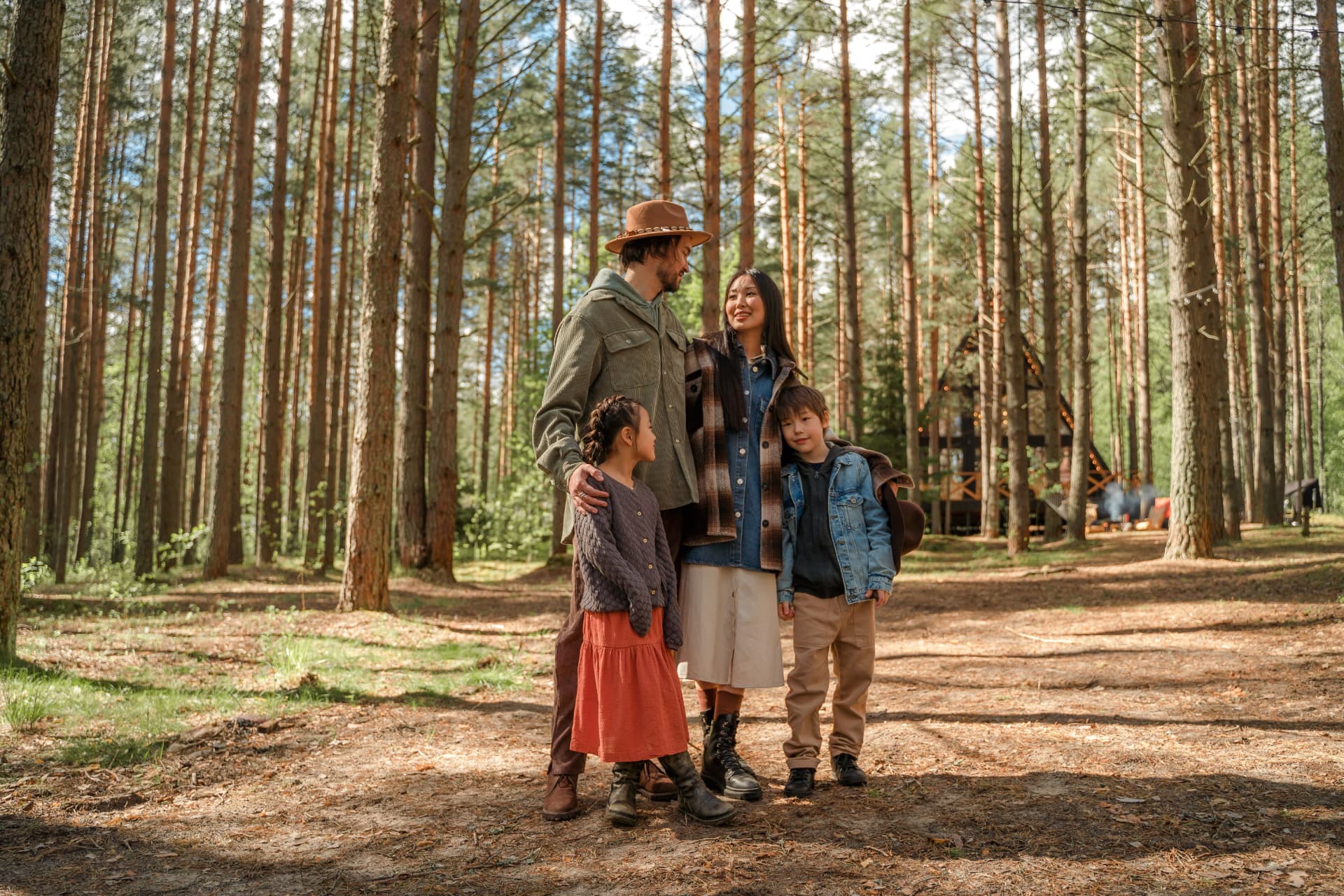 A family together in a pine forest